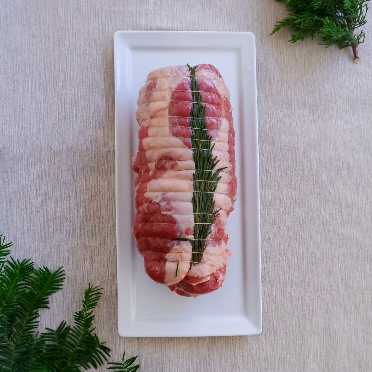 Stuffed leg of lamb roast with maître d'hôtel butter