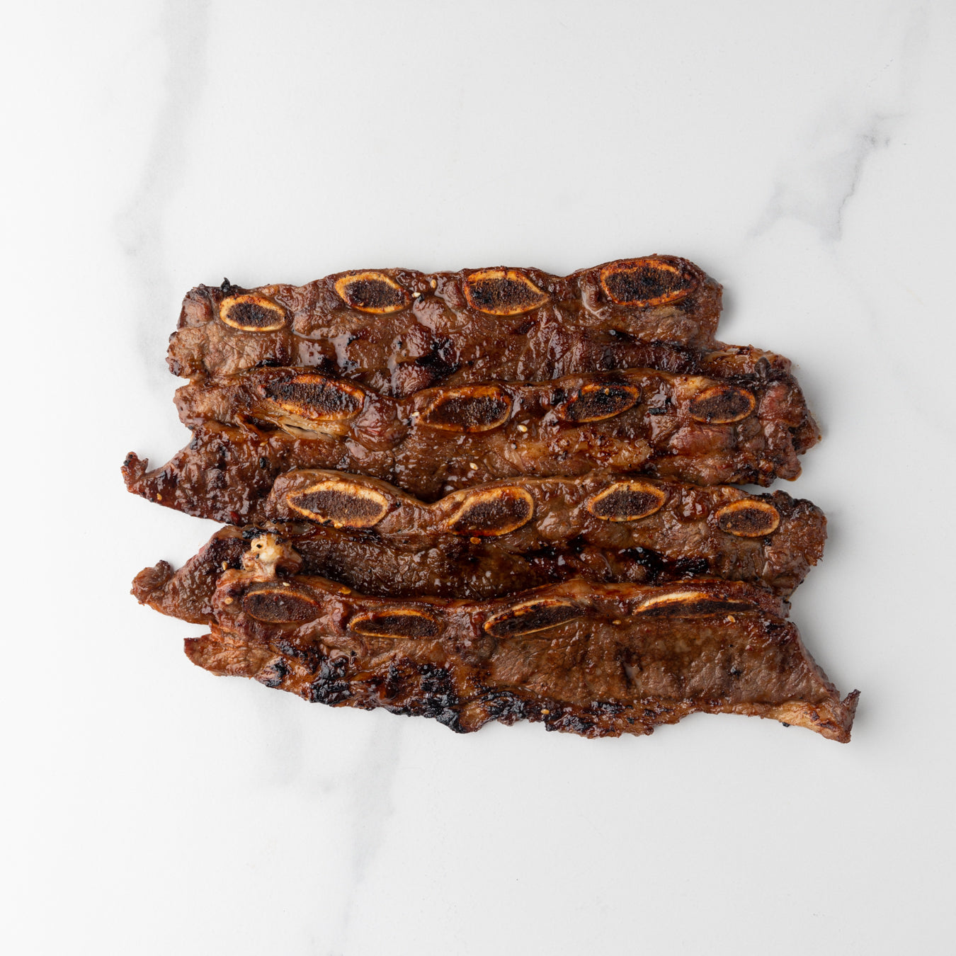 Short ribs (côtes courtes) de bœuf IPE coupées à la coréenne et marinées (précuites)